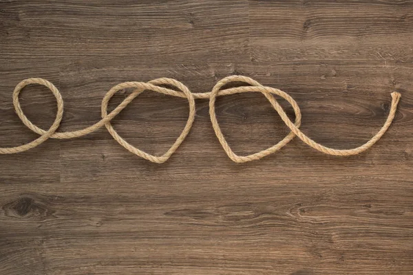 Two heart ropes connected to a knot — Stock Photo, Image