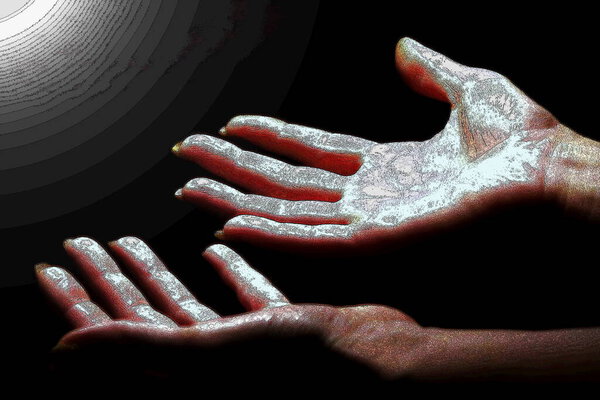 Two hands on a dark background stretch to the light