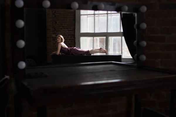 Woman Lies Piano Reflecting Mirror Lamps Large Windows — Stock Photo, Image