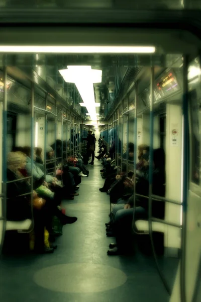 subway car shot inside with passengers. defocus