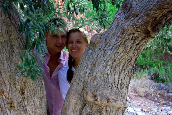 beautiful gorgeous couple on the tree of love cedar, on cyprus
