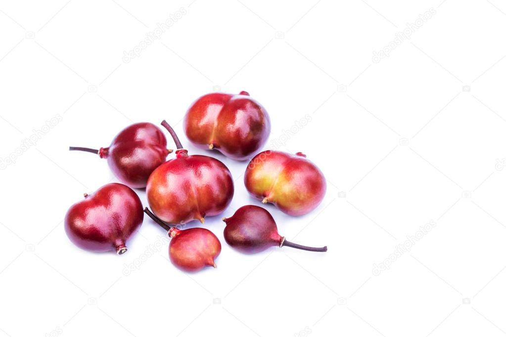 Luna nut (Lepisanthes fruticosa) isolated on white background. Eat as fresh fruit. Used to solve diarrhea in children to make juice.