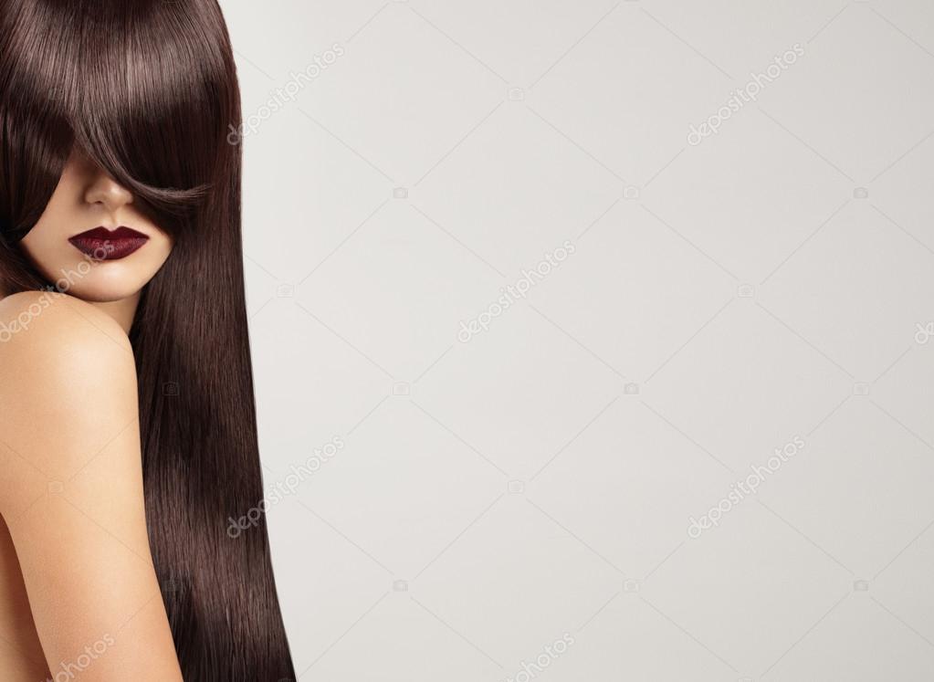 Woman with hair covering face Stock Photo by ©kazzakova 128116934