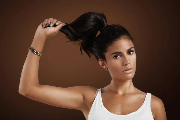 Spanish woman holds her hair — Stock Photo, Image