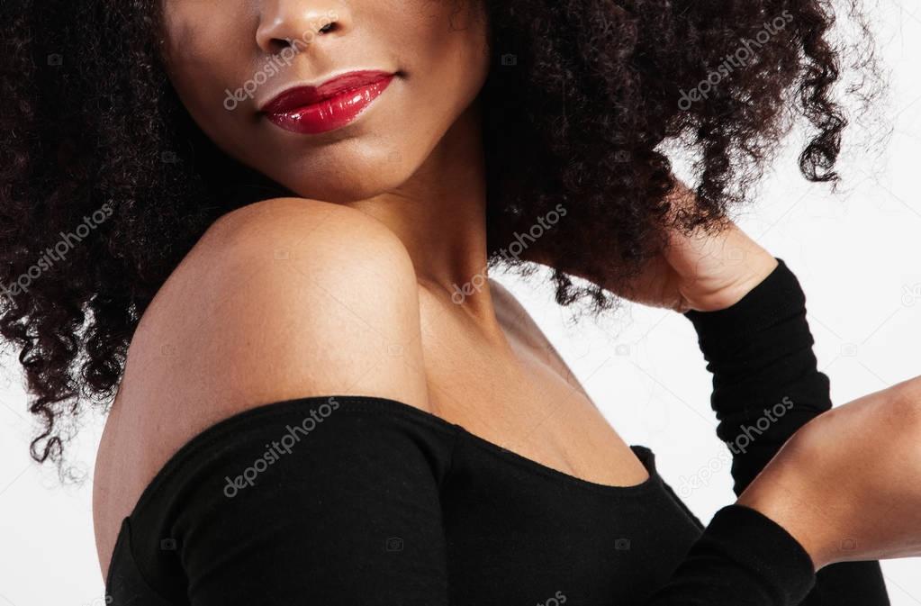 black woman lips with glossy red lipstick