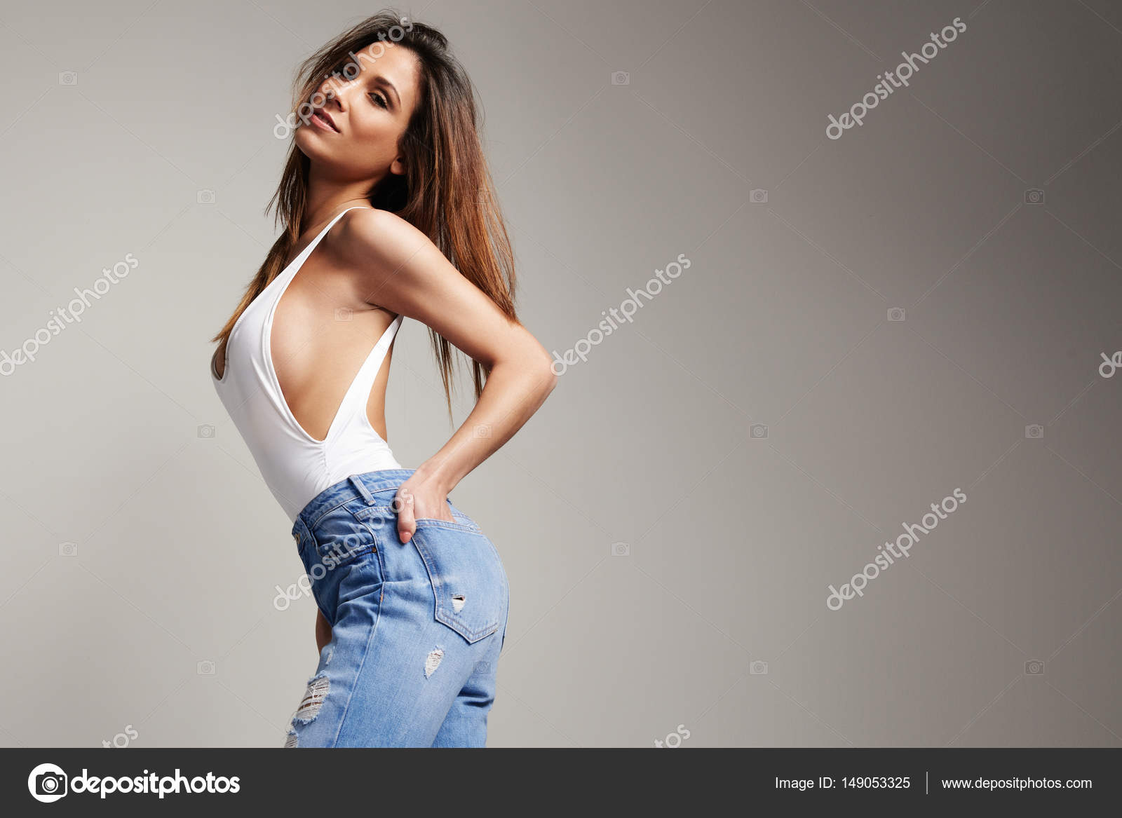 Beautiful spanish woman in jeans Stock Photo by ©kazzakova 12