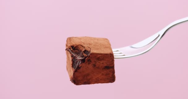 Stop motion of someone eats a truffle on fork — Stock Video