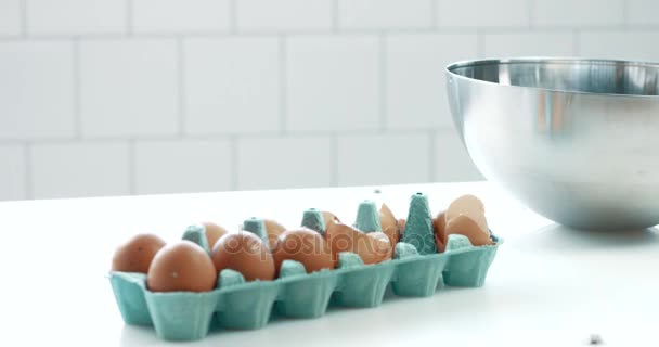 Pan movement of camera showing table with eggs and a bowl ready to make a cake — Stock Video