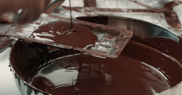 Liquid chocolate texture. Process of making a chocolate bars — Stock Video