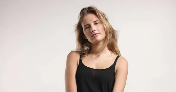 Beautiful blonde in black camisole — Stock Photo, Image