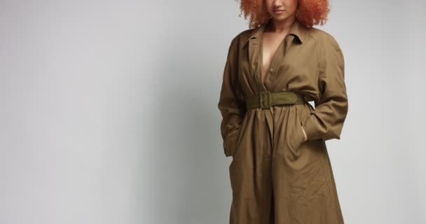 Attractive African model in khaki raincoat — Stock Video