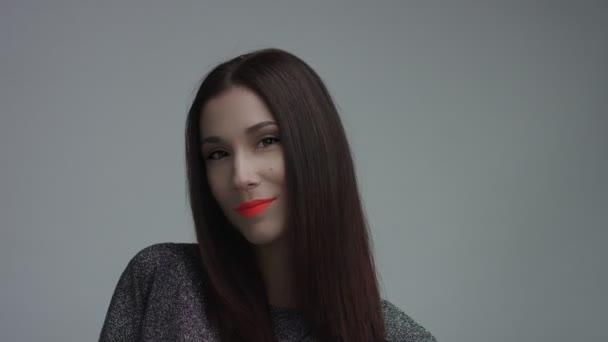 Closeup of spanish woman with vivid orange matte lipstick in studio — Stock Video