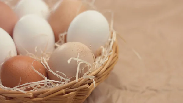 different eggs in basket