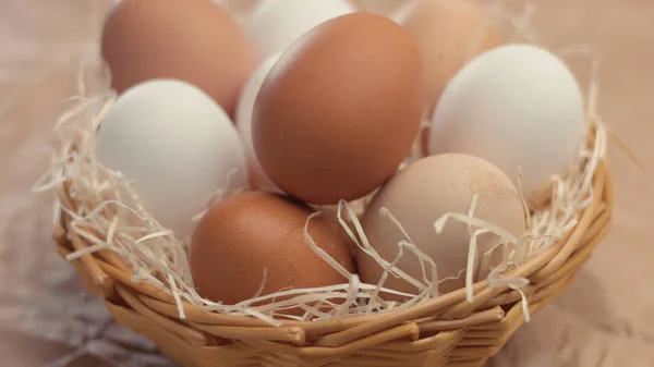 different eggs in basket