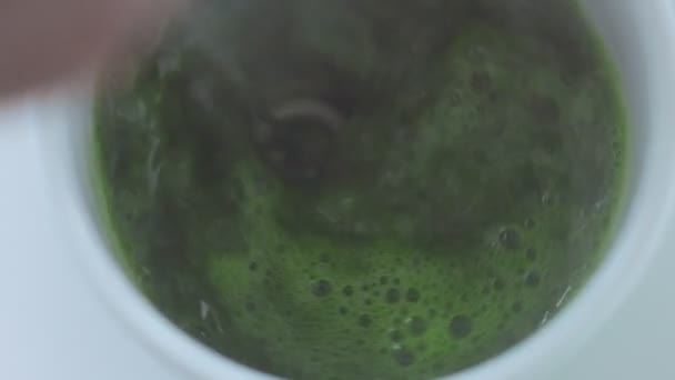 Matcha tea preparation in cafe by mixed race barman — Stock Video