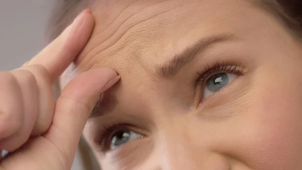 Closeup portrait of middle age woman showing her skin — Stock Photo, Image