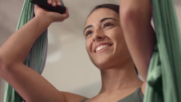 Adorable woman yoga trainer during aerial yoga master class — Stock Video