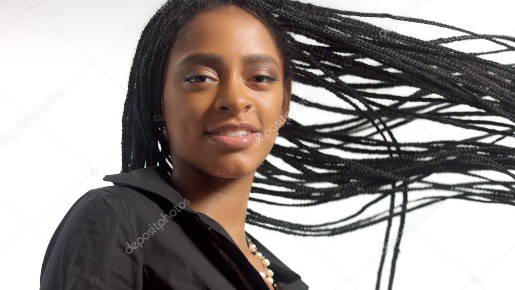 Mixed race woman with hair braids in studio on white portrait