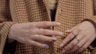 Closeupshowing classic jacket in goose paws warm brown print