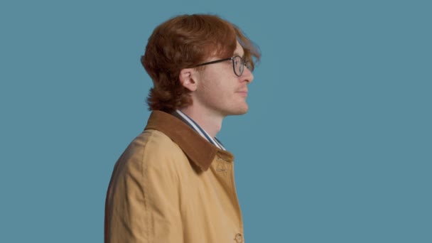 Stylish man in studio in vintage clothes calm watching to the camera and aside — Stock video