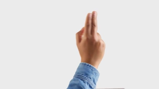 Mixed race deep skin tone male hand makes a swipe to the right with two fingers gesture on white — Wideo stockowe