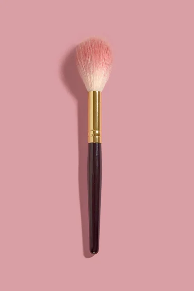 A makeup fluffy blush brush on pink — Stock Photo, Image