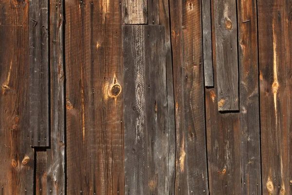 Mahogany wooden texture and background with scratches, brown wood planks for display