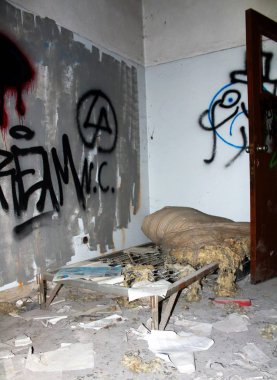 2019.06.16 - Limbiate, Milan, Italy, photographic reportage madhouse in Mombello, abandoned psychiatric hospital bed base and mattress broken and abandoned in a hospital room