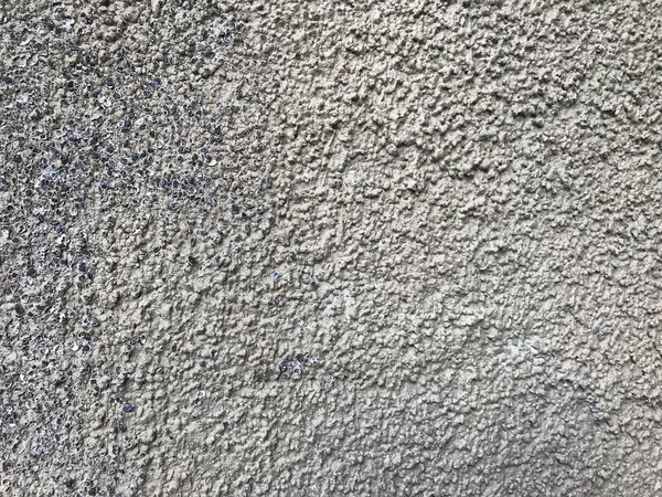 Padrão cinza e preto nobbly áspero da parede de cimento — Fotografia de Stock