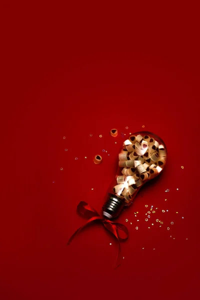 Light bulb with sweets inside. — Stock Photo, Image