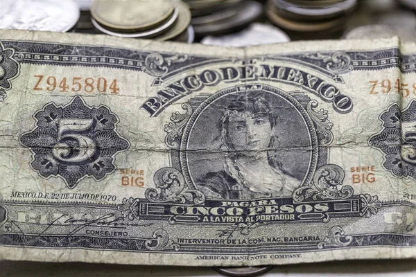 close up view of ancient coins and banknotes