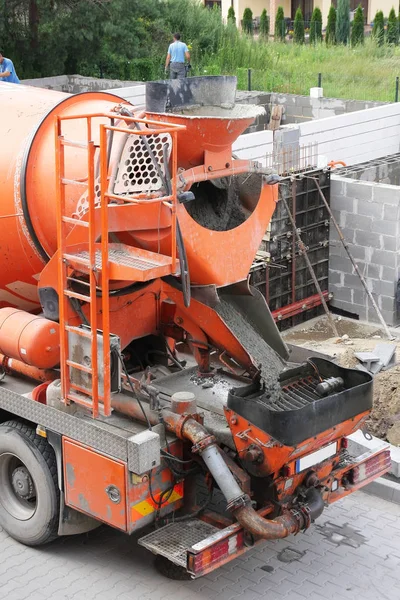 Orange concrete mixer — Stock Photo, Image