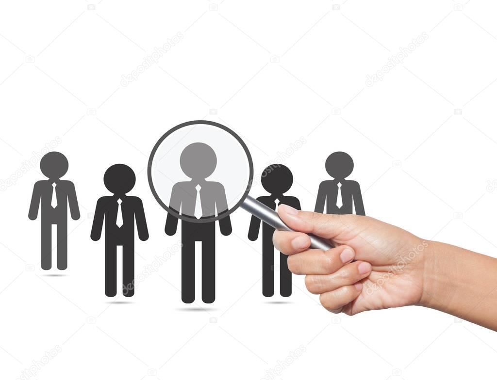 Hiring staff concept. Hand with magnifying glass finding and rec