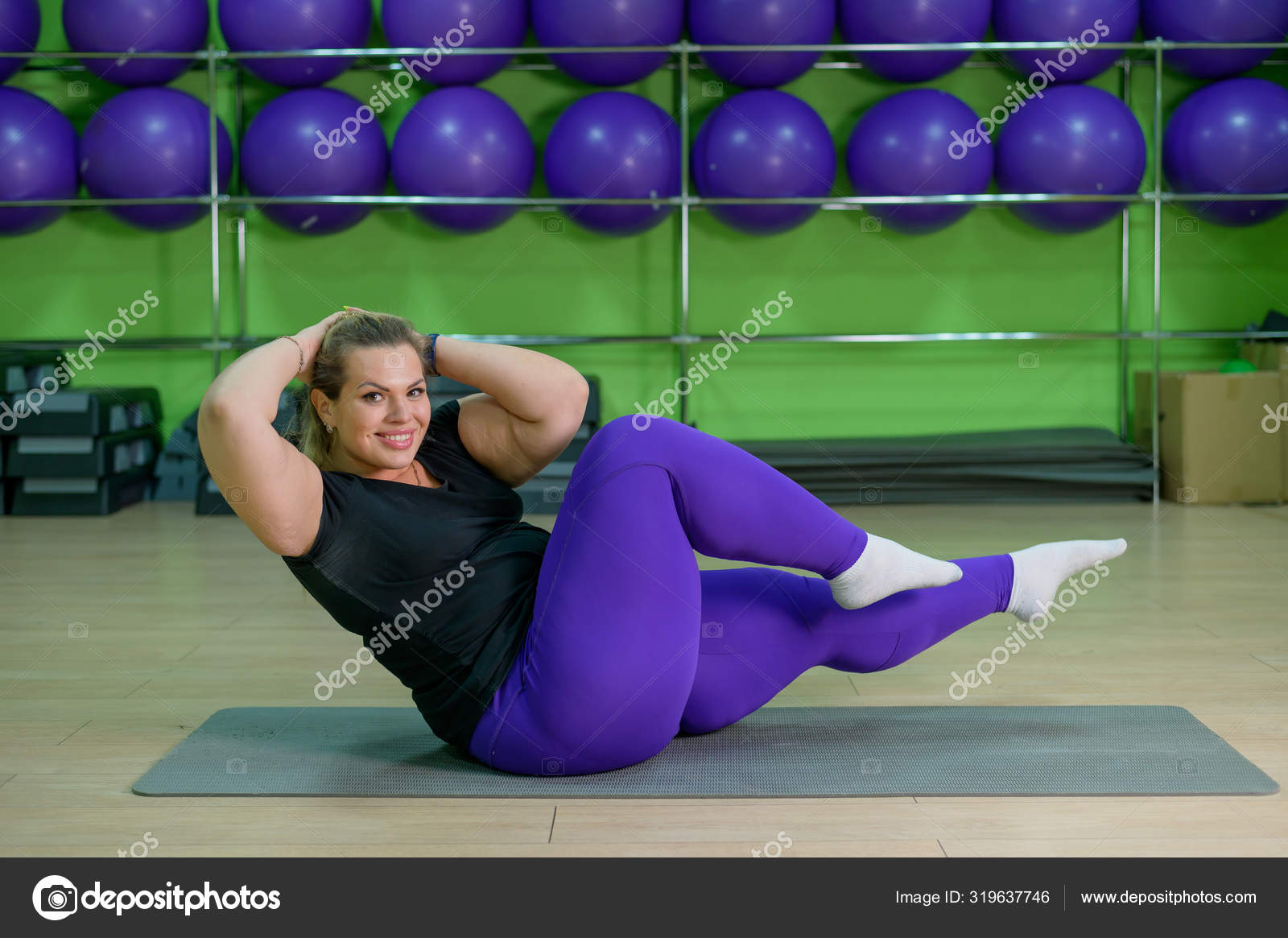 A fat woman is engaged in aerobics and trying to lose weight. An