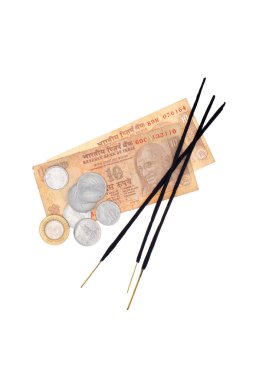Indian rupees and incense sticks  clipart