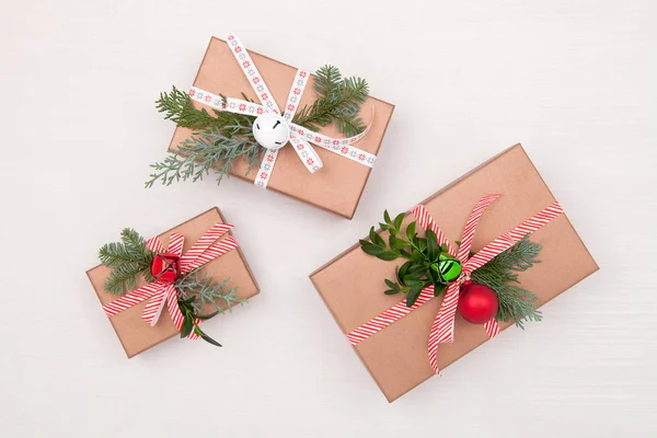 Christmas composition. Gifts, fir tree branches, jingle bells on — Stock Photo, Image