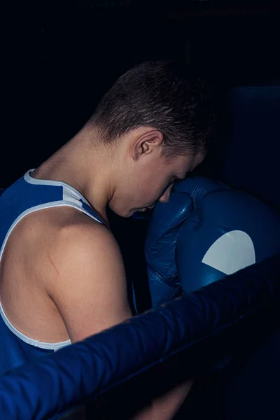 teen boxer in the corner of the ring