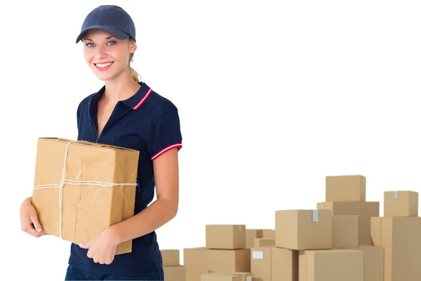 Delivery woman holding cardboard box — Stock Photo, Image
