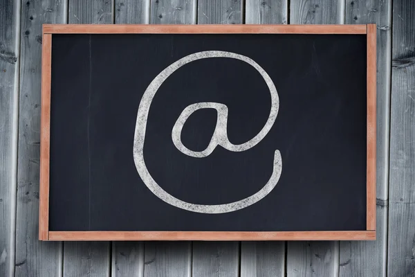 Black at symbol drawing against blackboard — Stock Photo, Image