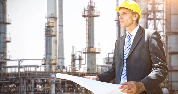 Thoughtful architect holding blueprint — Stock Photo, Image