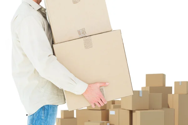 Delivery man carrying cardboard boxes — Stock Photo, Image