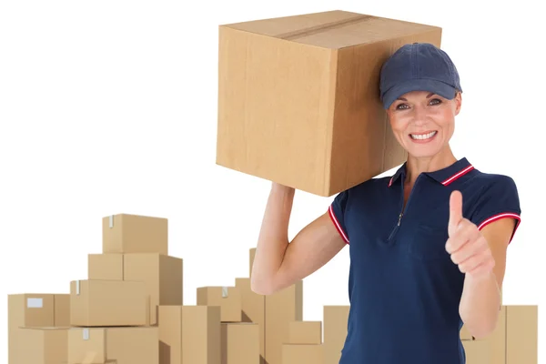 Woman holding cardboard box showing thumbs up — Stock Photo, Image