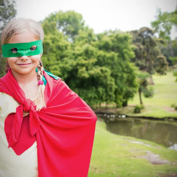 Cute girl in red cape — Stock Photo, Image