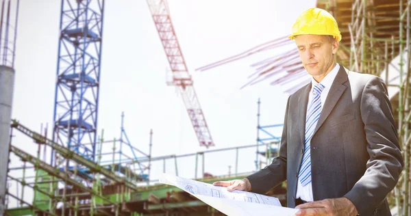 Architect holding blueprint — Stock Photo, Image