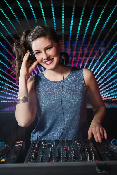 Pretty female DJ playing music — Stock Photo, Image