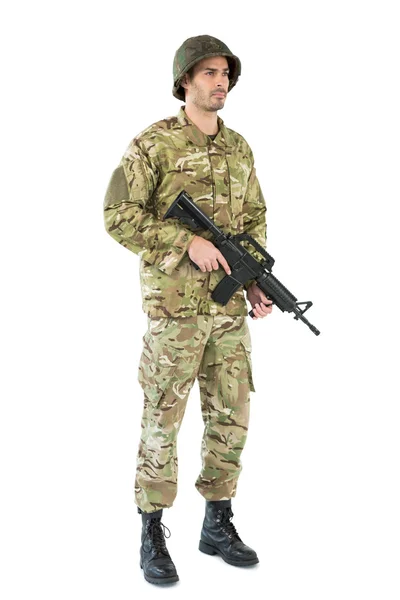 Soldier holding a rifle — Stock Photo, Image