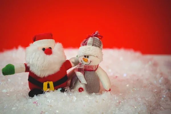 Papai Noel e boneco de neve na neve — Fotografia de Stock