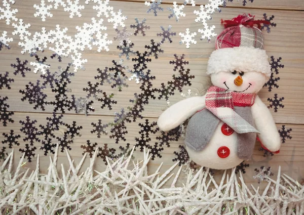 Muñeco de nieve y decoración de Navidad en la mesa — Foto de Stock