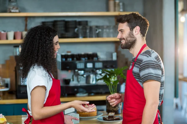 Waiter and waitress interacting — Stock Photo, Image