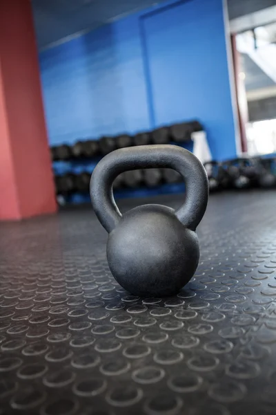 Kettlebell on floor in gym — Stock Photo, Image